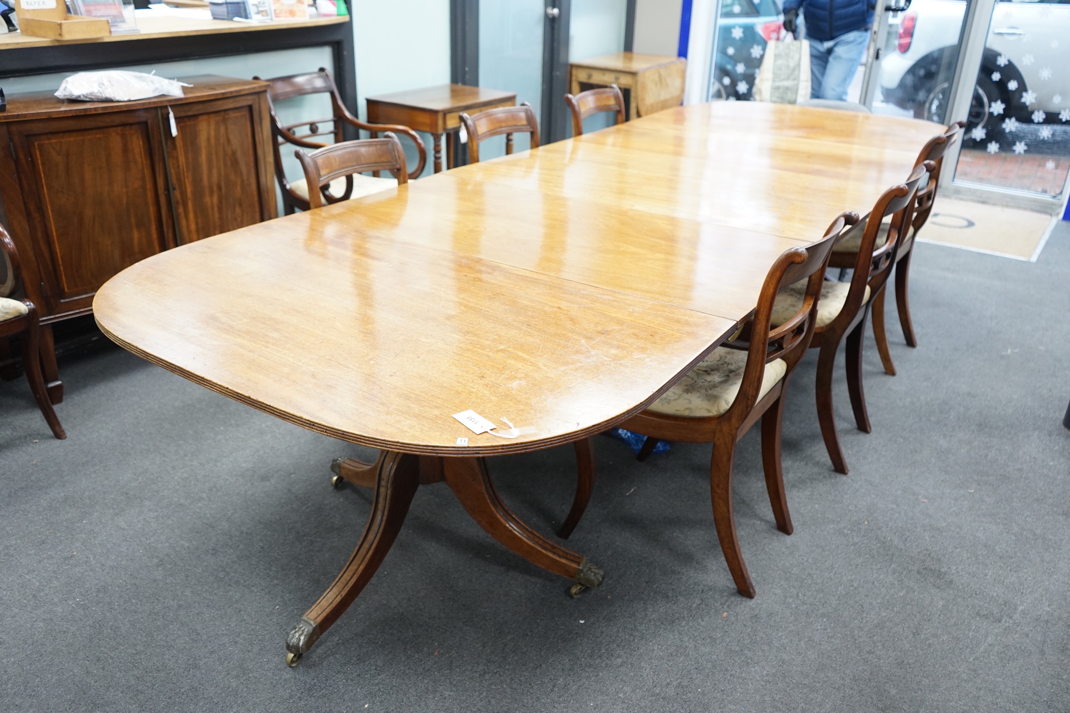 A George IV mahogany triple pedestal extending dining table, length 341cm extended, two spare leaves, width 124cm, height 70cm